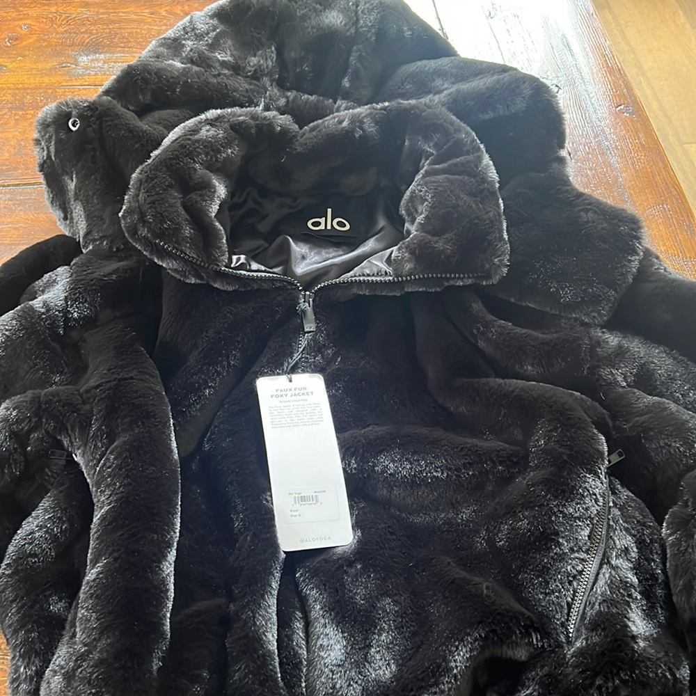 New size small, black Alo Faux Fur Foxy Jacket with removable hood.